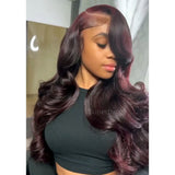 A woman wearing a dark burgundy 13x4 transparent lace front wig with pre-plucked hairline and body wave side parting