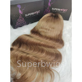 Voluminous shoulder-length wavy human hair wig with 13x6 transparent lace front and natural blonde to dark brown ombre color
