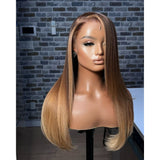 A 13x6 transparent lace front preplucked highlight ombre wig with straight long brown and blonde hair and a natural part