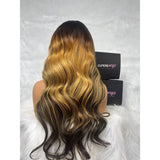 A voluminous body wave wavy 360 HD lace wig with upgraded pre-plucked hairline and invisible strap ombre color
