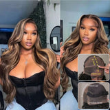A 6-inch fitted cap lace wig with long wavy two-toned brown and blonde hair and an invisible strap body wave