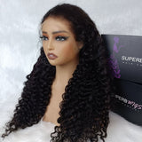 Black voluminous curly human hair wig with lace upgraded hairline displayed on mannequin head for natural look