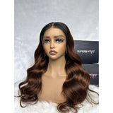 A deep brown ombre color HD lace 13x6 fitted cap ear tap wig with subtle highlights and body wave wavy texture