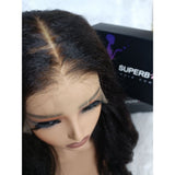 Black wavy human hair lace front ear tap wig with natural part and subtle highlights fitted cap ear design