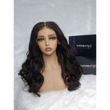 Dark brown voluminous wavy human hair hd lace 13x6 fitted cap ear tap wig displayed on mannequin head