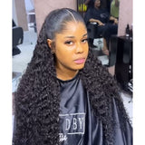 Black voluminous curly hair extensions with natural part and defined loose wave in lagos m-shaped hairline 13x6 hd lace front wig